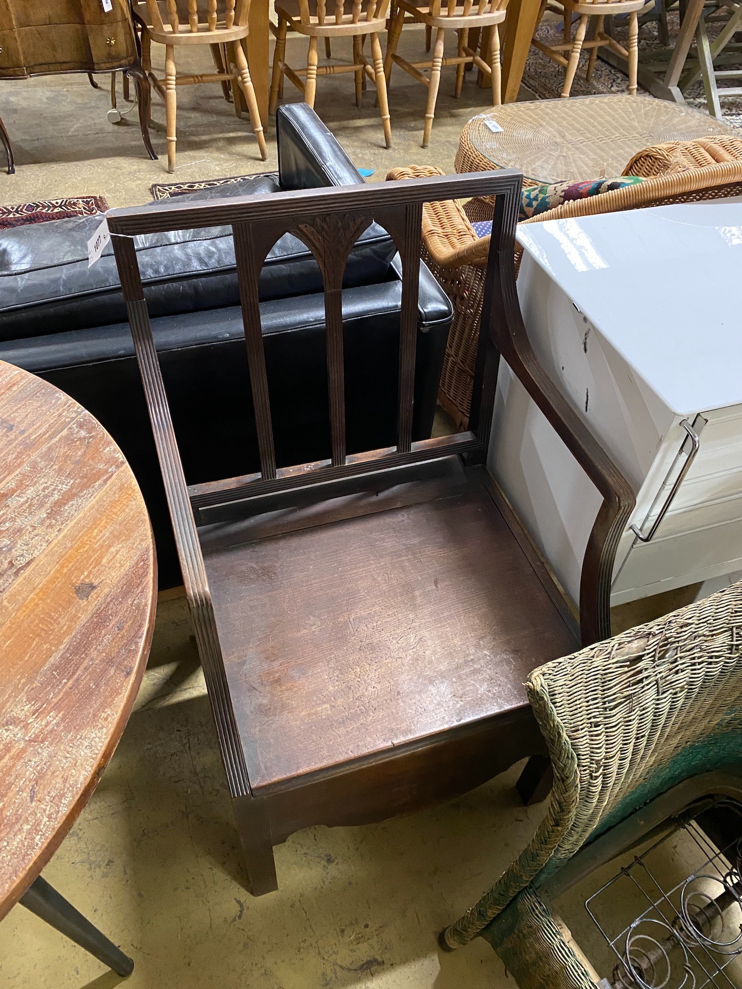 A green painted Lloyd Loom armchair and a Regency mahogany commode chair